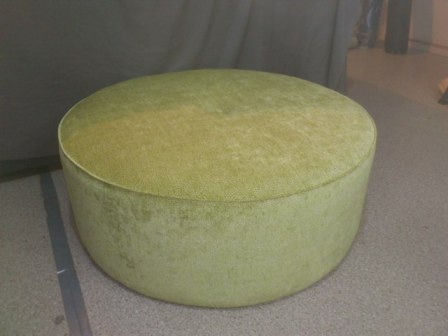 Round upholstered ottoman