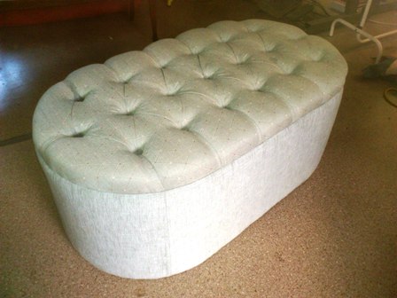 Oval ottoman with deep buttons